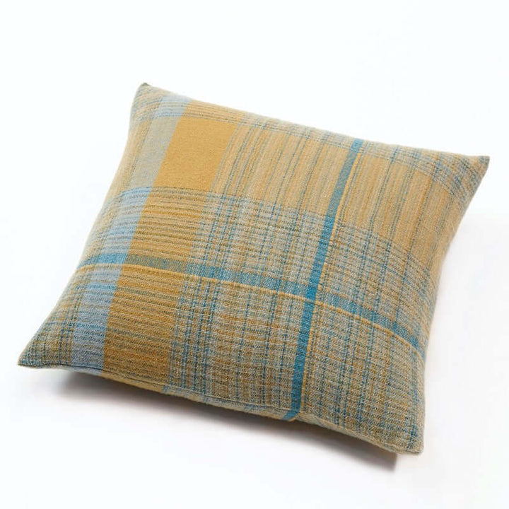 pillow covers in square shapes in 100% Merino wool. Llghtweight, flat woven pieces made with 100% pure Merino wool woven in 5 shades of olive green & turquoise colors
