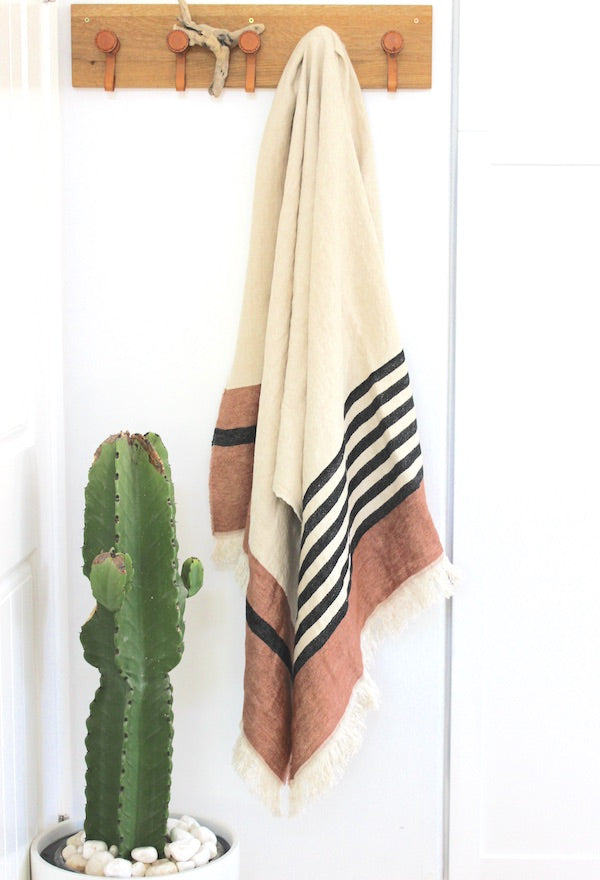 Inyo Belgian linen throw towel is cream background with red sedona and black stripes
