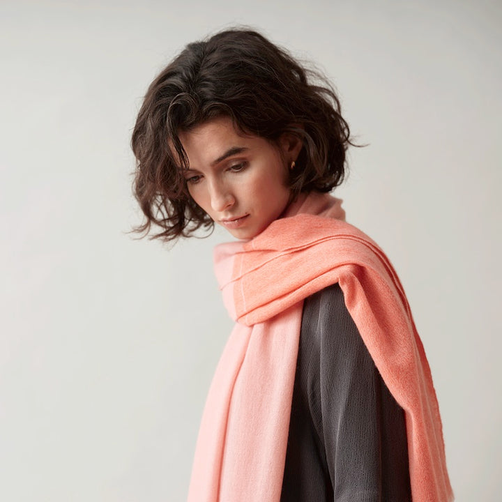 Salmon shawl, woven by hand loom in Terrassa (Barcelona), using the supreme delicacy of cashmere fibre, design by Helena Rohner for Teixidors is the finest Italian cashmere worn by a understated chic woman