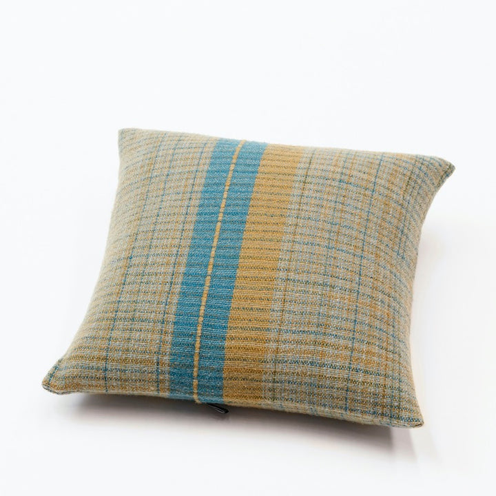 pillow covers in square shape in 100% Merino wool. Llghtweight, flat woven pieces made with 100% pure Merino wool woven in 5 shades of olive green & turquoise colors