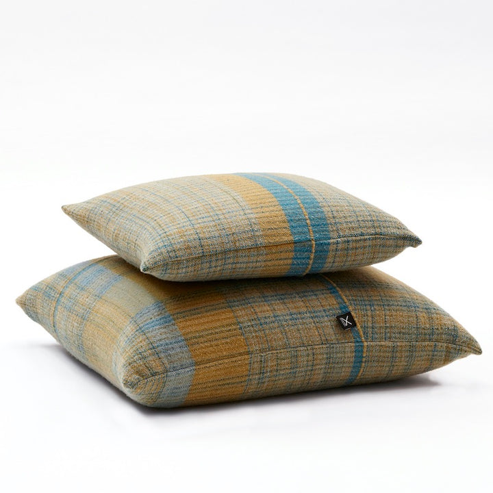  pillow covers in rectangular shapes in 100% Merino wool. Llghtweight, flat woven pieces made with 100% pure Merino wool woven in 5 shades of olive green & turquoise colors