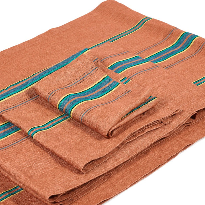 Libeco Belgian linen tablecloth, The Ontario Stripe, stunning classic table linen fabric in a pure linen herringbone with the green, blue, yellow, black multi-colored stripes sit on a terracotta ground.
