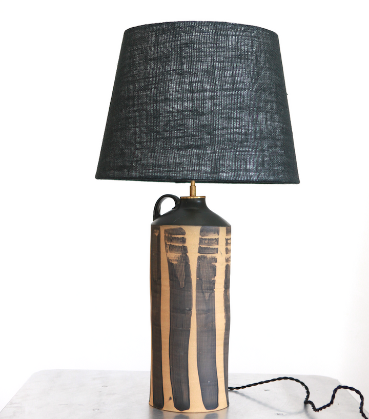 Handcrafted ceramic table lamp with bold black brush strokes on tan cylinder with black jute shade