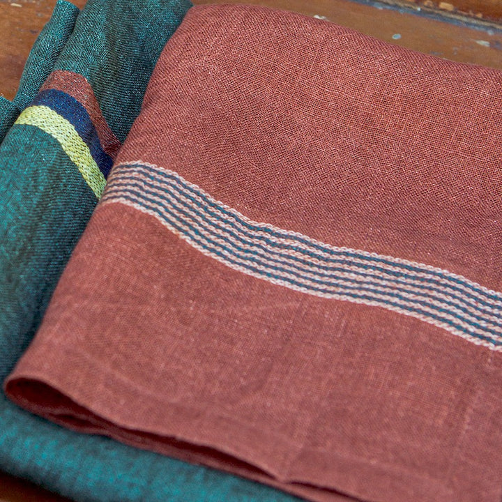 Libeco 100% Belgian linen signature open weave napkin is stylish and soft to the touch. Banff carries stripes in evergreen, mustard and old rose on a mahogany-colored ground. It is a decorative napkin that ornate your table setting and culinary design in uncomplicated way.  From rustic European country style to modern high design, the high art of the textile brings out sensations of conviviality and appreciation for simple beauty.