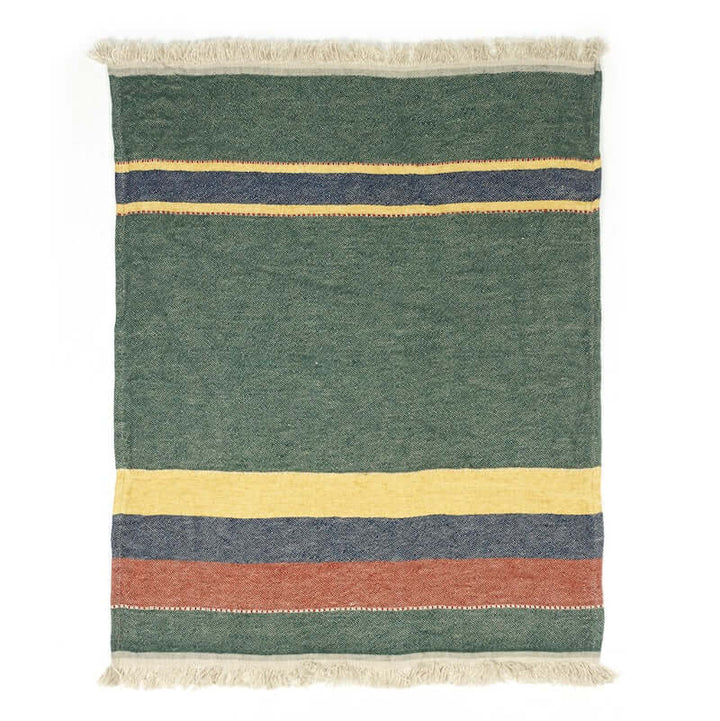 Libeco Belgian linen throw Spruce has a green ground with stripes in gold, navy, and mahogany with flax-colored fringe.