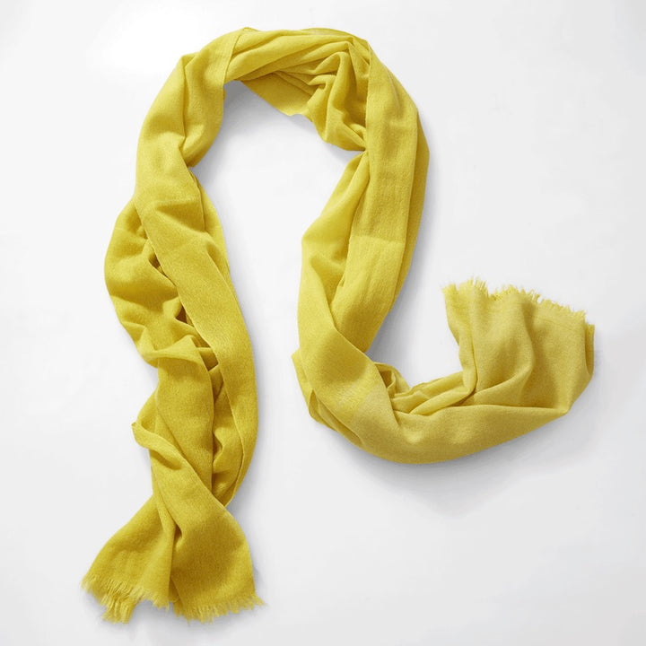 Mustard yellow shawl, woven by hand loom in Terrassa (Barcelona), using the supreme delicacy of cashmere fibre, design by Helena Rohner for Teixidors is the finest Italian cashmere 